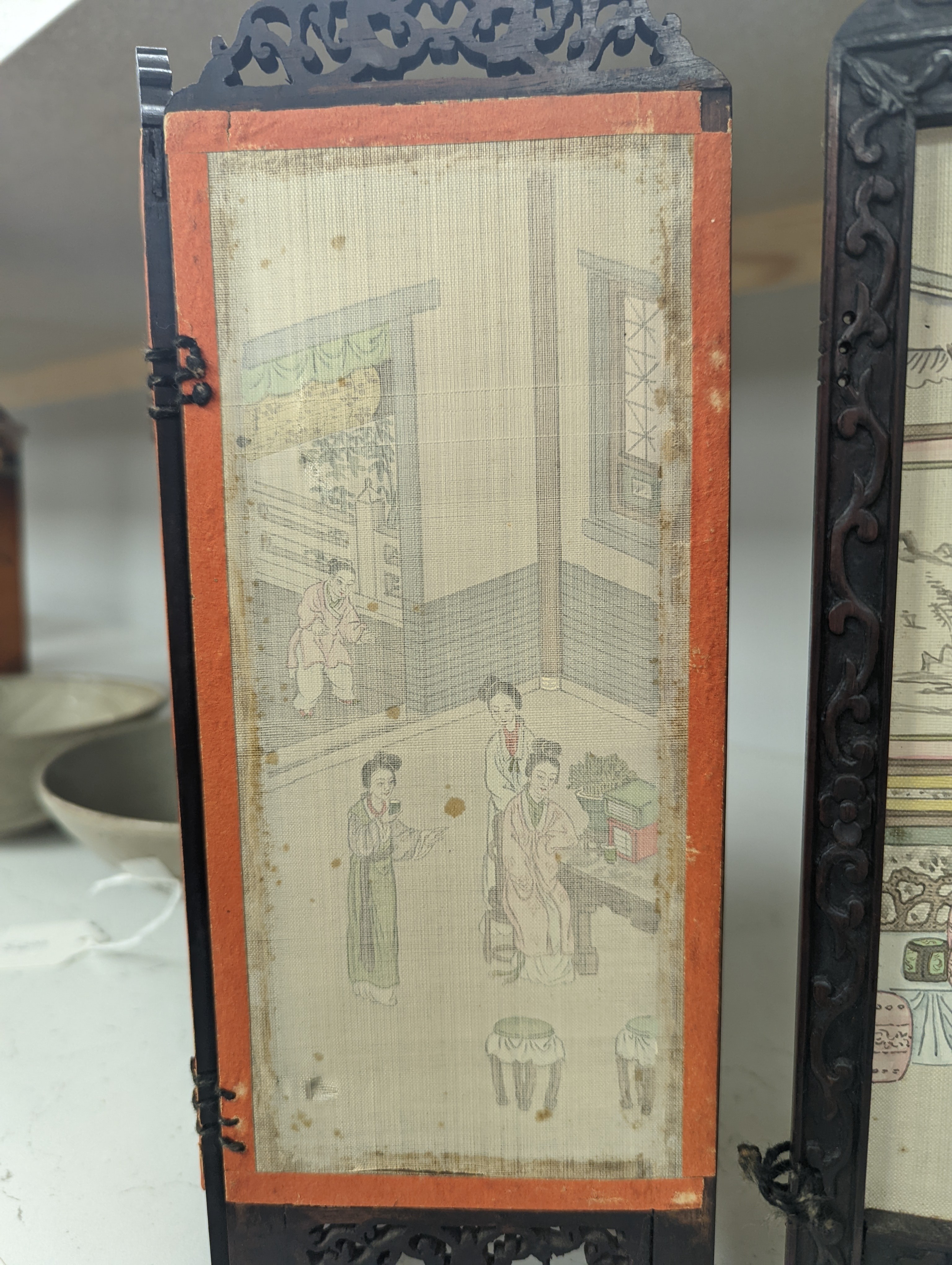 A Chinese hardwood framed painted silk four fold miniature screen, inset with painted silk panels, 28cm